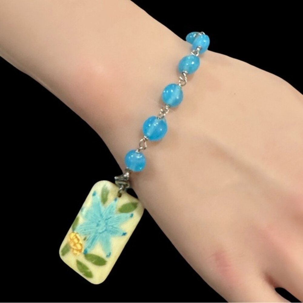 Handcrafted Blue Beaded Bracelet With Floral Pendant